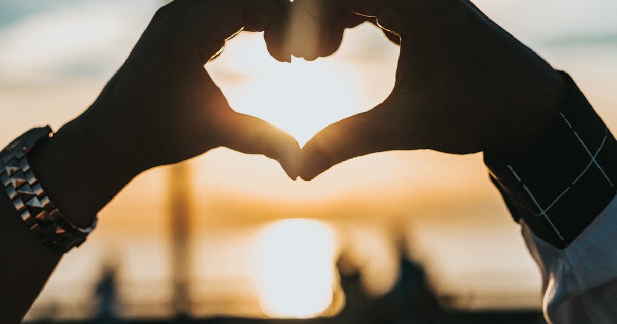 Couple creating joint gift list together on laptop